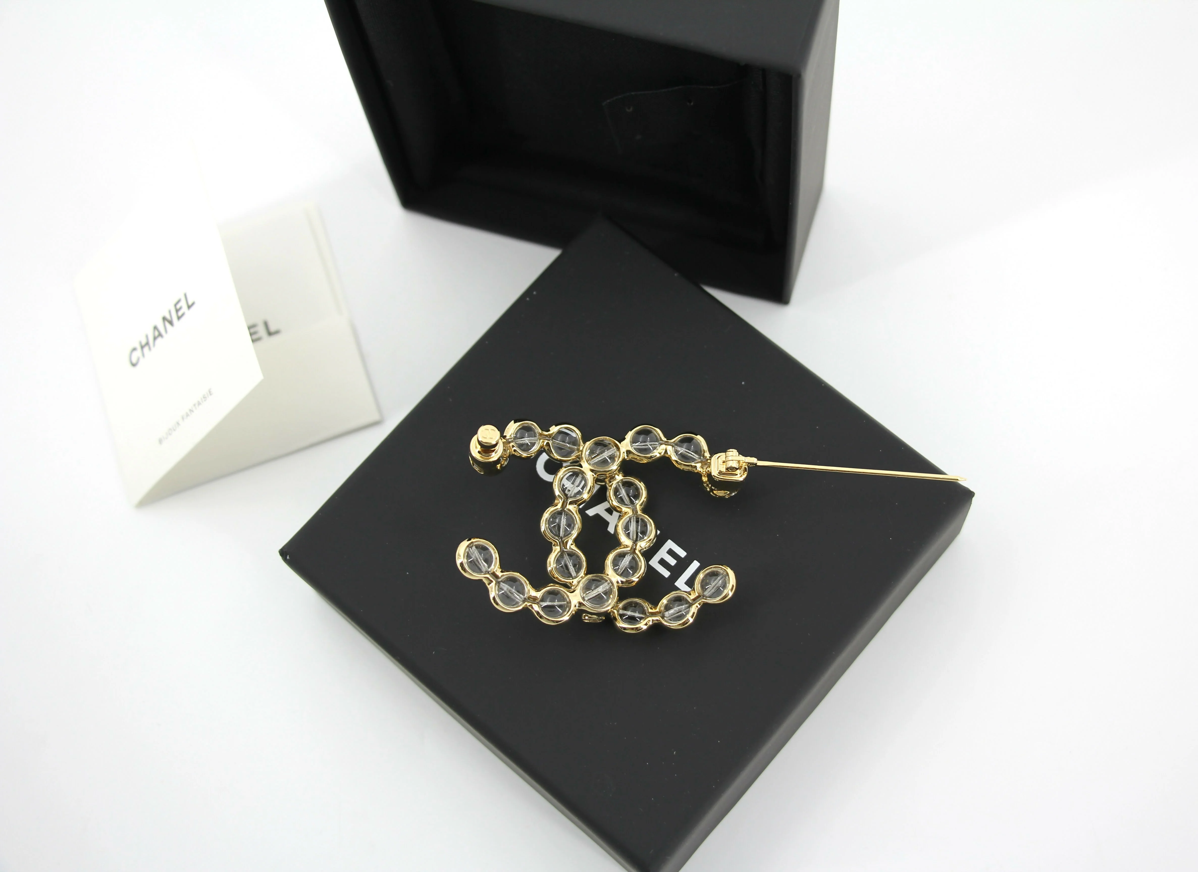 Chanel A24S Acrylic CC Champagne Gold Transparent Brooch
