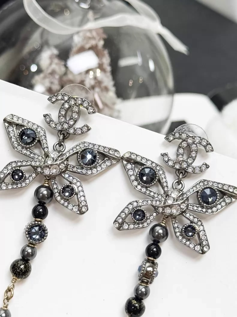 Chanel Métiers dArt silver butterfly long stud earrings