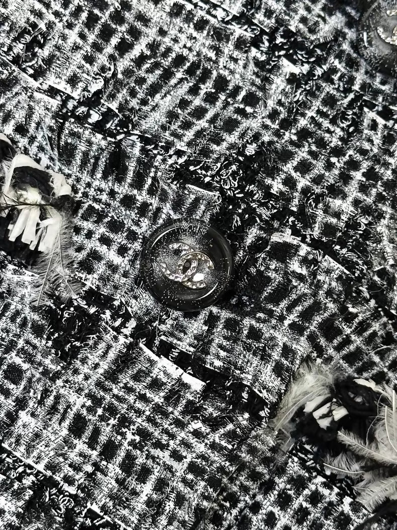 Chanel Spring/Summer 2011 black and white tweed jacket.