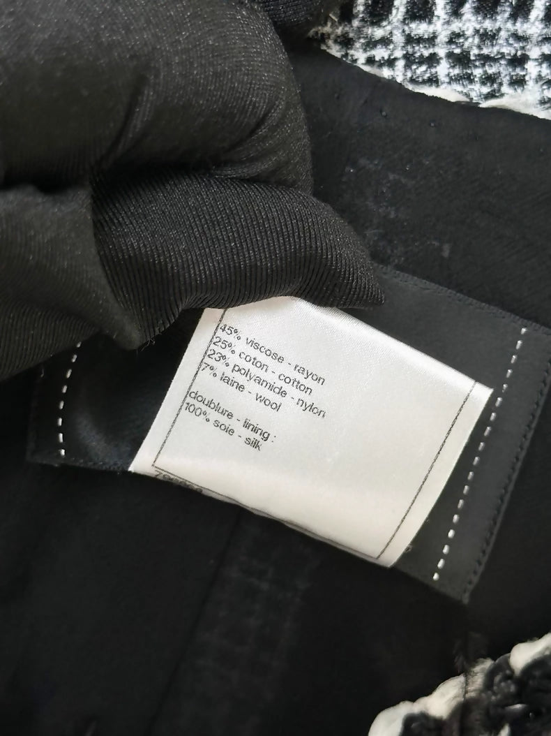 Chanel Spring/Summer 2011 black and white tweed jacket.