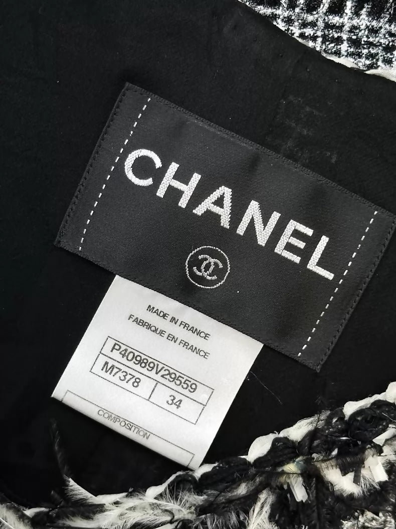 Chanel Spring/Summer 2011 black and white tweed jacket.