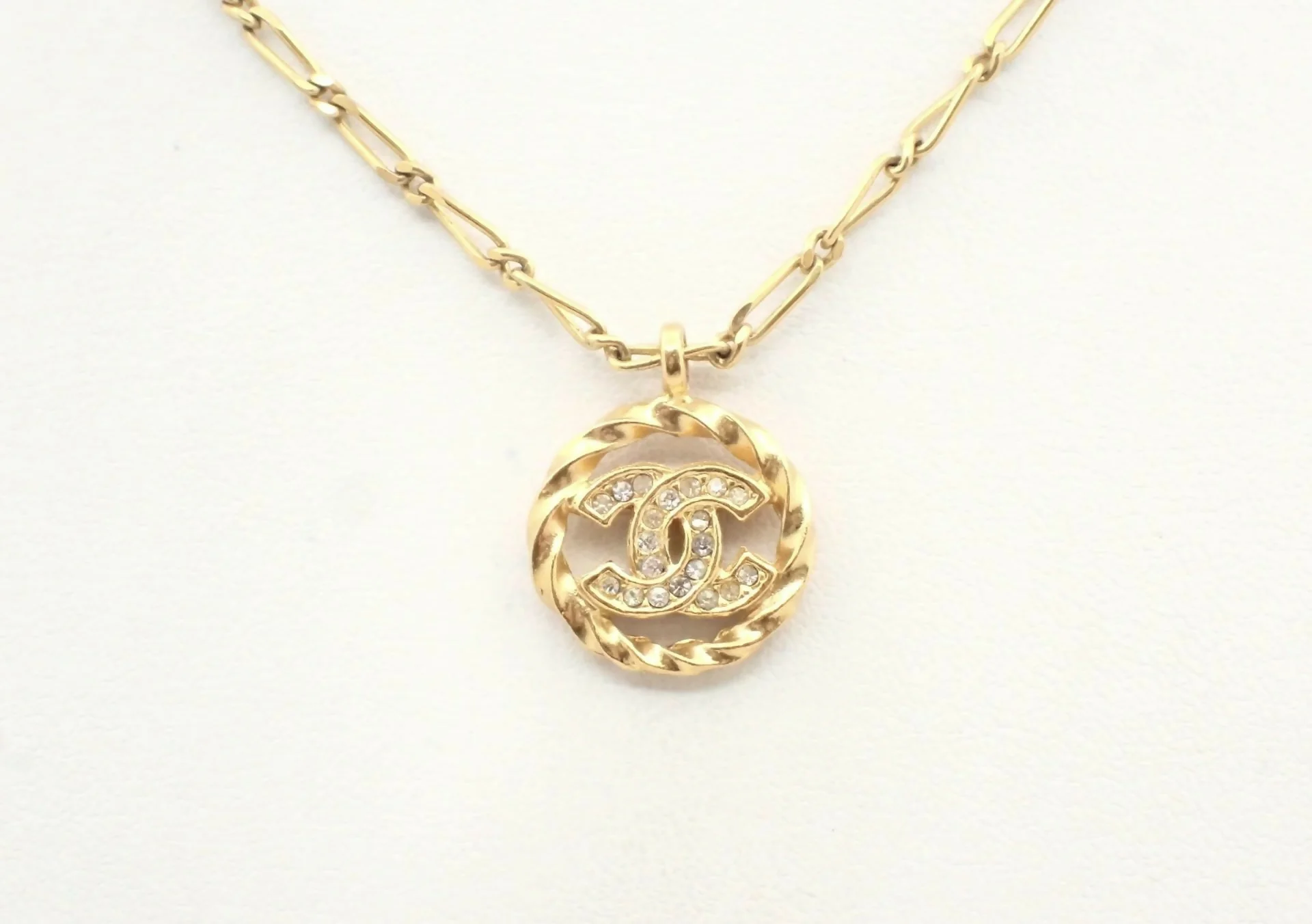 Chanel Vintage 1982 Rhinestone Gold Plated Braided Medallion Interlocking Coco Mark Necklace
