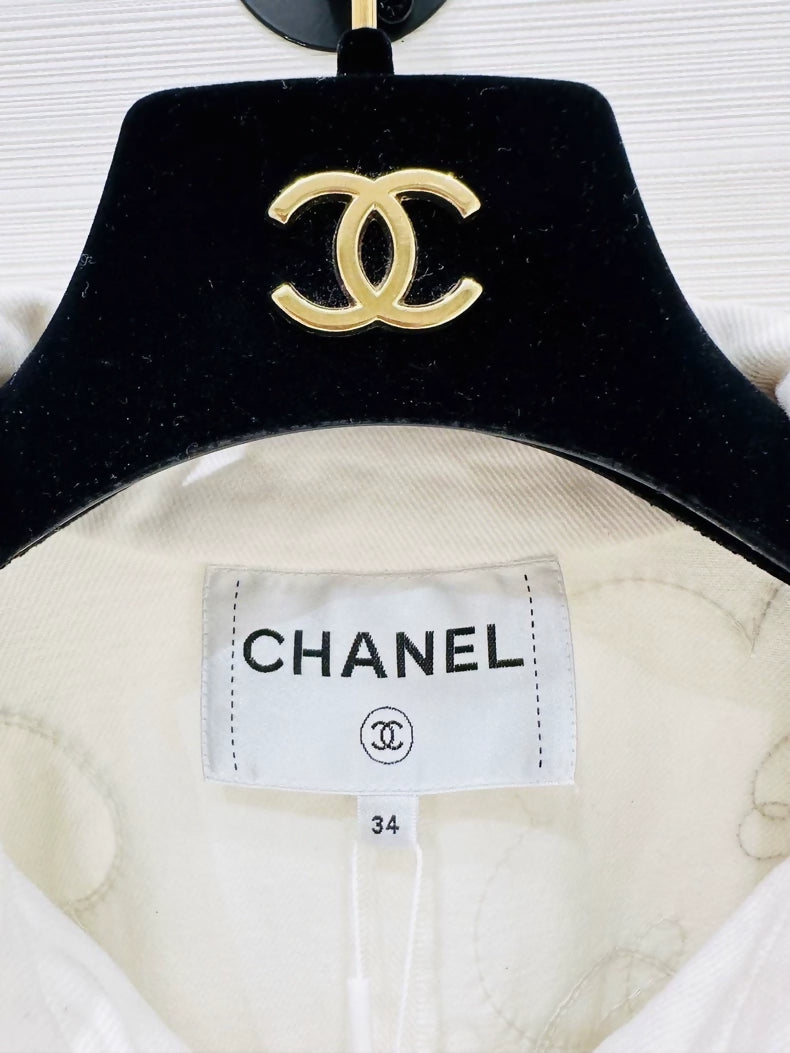Chanel Métiers dArt white denim jacket with beaded camellia